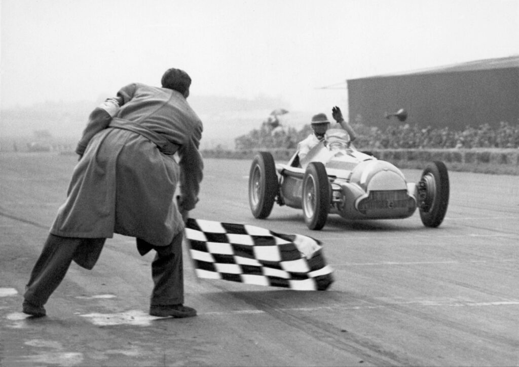 The Argentine racecar driver Juan Fangio wins the race